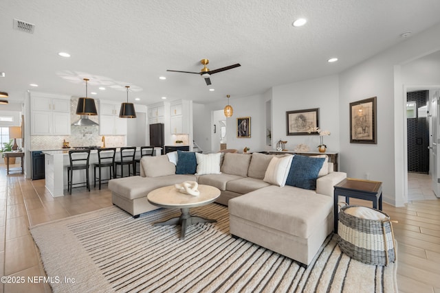 230 Marquesa Cir, Saint Johns, FL 32259 - living room featuring recessed lighting, visible vents, ceiling fan, a textured ceiling, and stairs