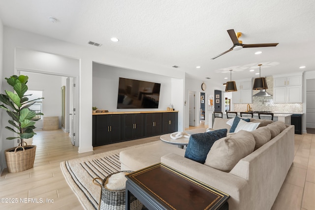 230 Marquesa Cir, Saint Johns, FL 32259 - living area featuring a textured ceiling, a ceiling fan, visible vents, and recessed lighting