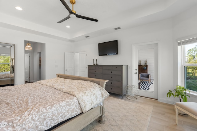 230 Marquesa Cir, Saint Johns, FL 32259 - bedroom with light wood-type flooring, a tray ceiling, visible vents, and recessed lighting