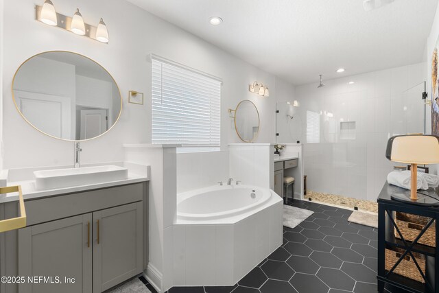 230 Marquesa Cir, Saint Johns, FL 32259 - full bath featuring two vanities, a sink, a tile shower, tile patterned flooring, and a bath