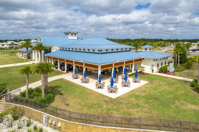 230 Marquesa Cir, Saint Johns, FL 32259 - exterior space featuring metal roof, a patio area, a yard, and fence