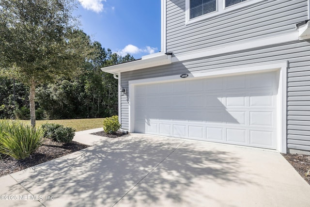 garage featuring driveway