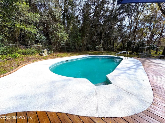 pool featuring a fenced backyard