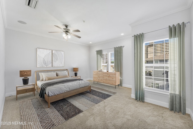 bedroom with ceiling fan, carpet floors, visible vents, baseboards, and crown molding