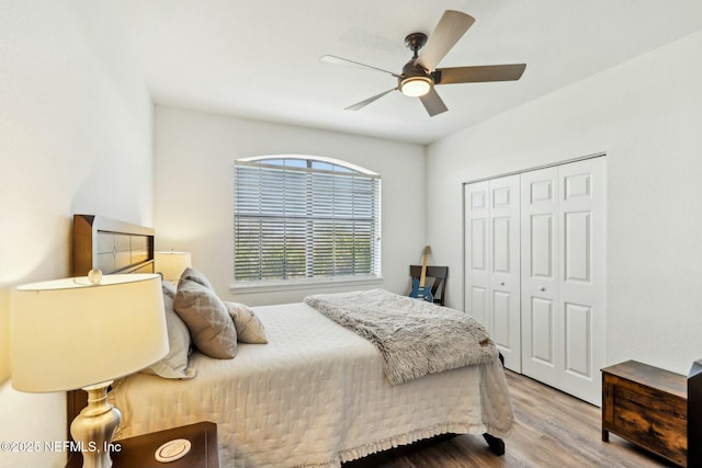 bedroom featuring a closet, ceiling fan, and wood finished floors