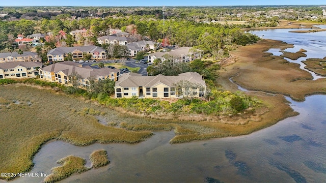 bird's eye view with a water view and a residential view