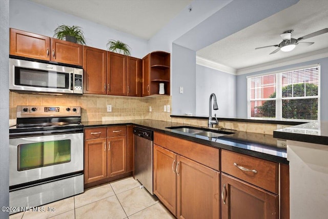 kitchen featuring appliances with stainless steel finishes, a sink, a peninsula, and open shelves