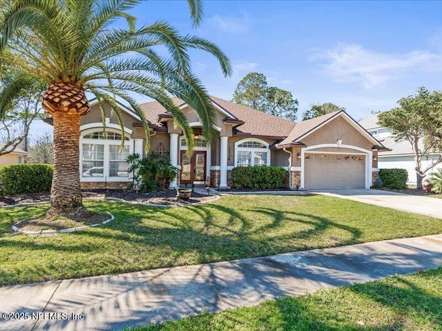 view of front facade featuring driveway, a front lawn, an attached garage, and stucco siding