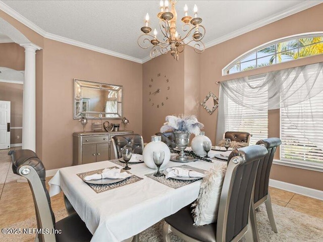 dining room featuring baseboards, arched walkways, ornamental molding, ornate columns, and light tile patterned flooring