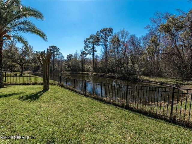 view of water feature with fence