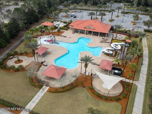 pool featuring a gazebo, a water slide, and a patio area