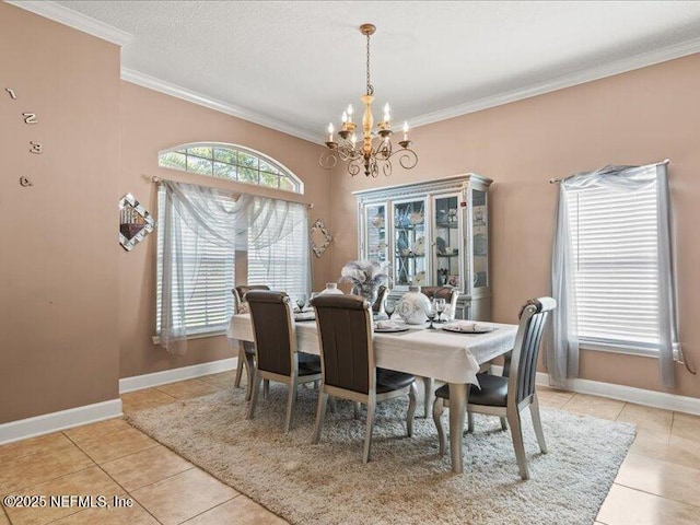 dining room with a healthy amount of sunlight, an inviting chandelier, and crown molding