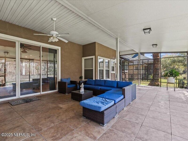 view of patio / terrace with ceiling fan, an outdoor hangout area, and fence