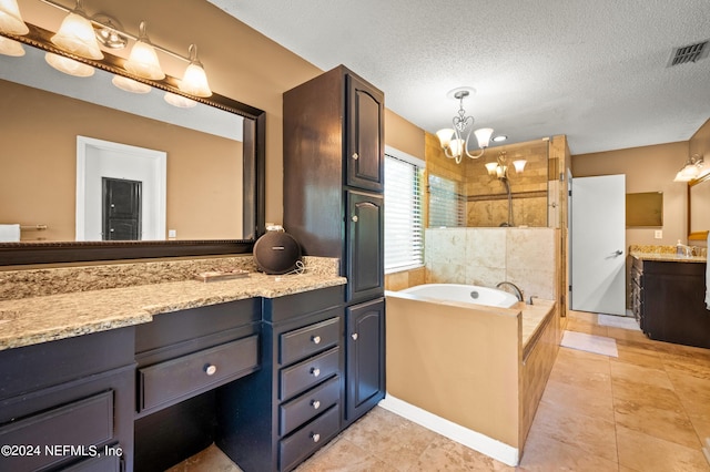 full bathroom featuring a textured ceiling, a garden tub, visible vents, vanity, and tiled shower