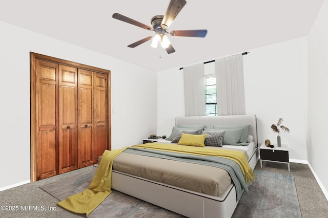 bedroom featuring dark carpet, a ceiling fan, and baseboards