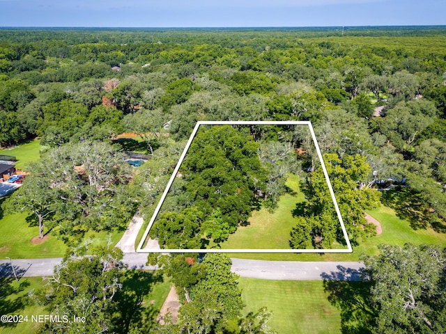 aerial view featuring a wooded view