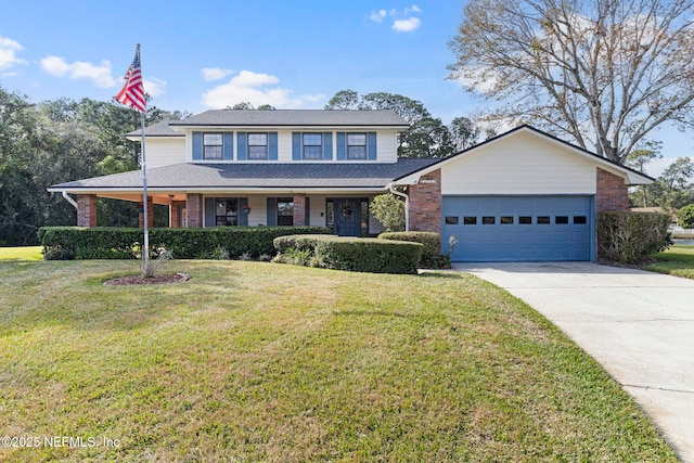 traditional home featuring a garage, brick siding, and a front yard