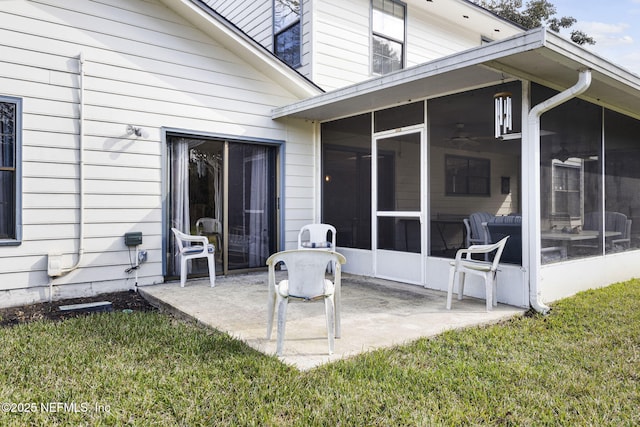 view of patio / terrace featuring a sunroom