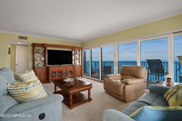 carpeted living room with ornamental molding and visible vents