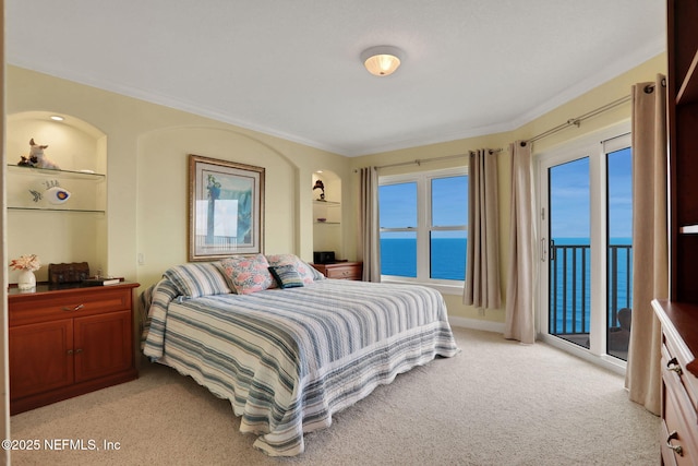 bedroom with a water view, access to outside, light carpet, and ornamental molding