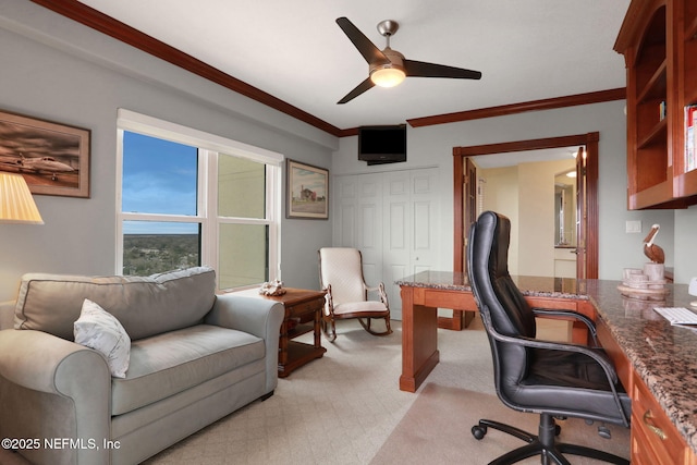 office featuring light carpet, ceiling fan, and crown molding