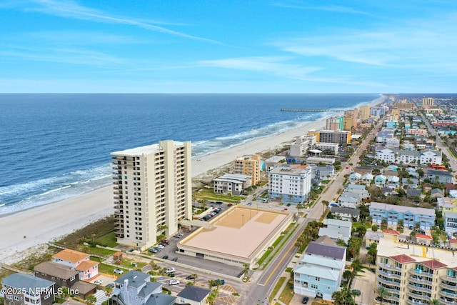 birds eye view of property with a view of city, a water view, and a view of the beach