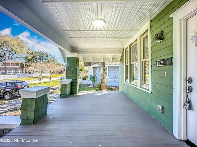 wooden deck featuring covered porch