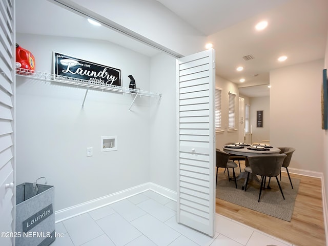 clothes washing area with laundry area, visible vents, baseboards, hookup for a washing machine, and recessed lighting