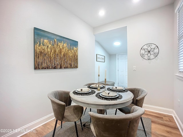 dining room featuring baseboards and wood finished floors