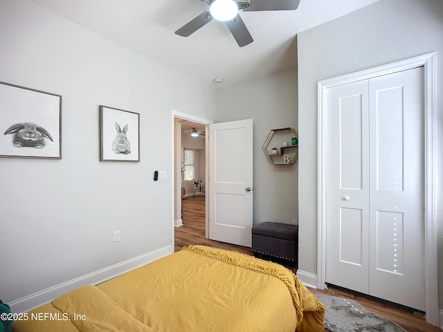 unfurnished bedroom with a closet, baseboards, and wood finished floors