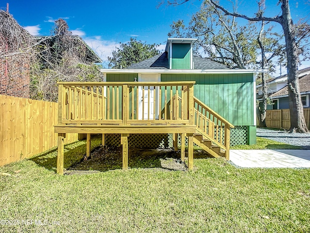 deck featuring fence and a lawn