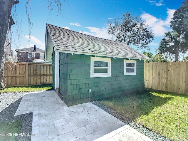 view of outbuilding featuring an outbuilding and a fenced backyard