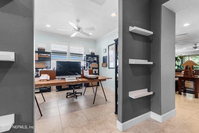 home office featuring light tile patterned floors, visible vents, a ceiling fan, ornamental molding, and baseboards