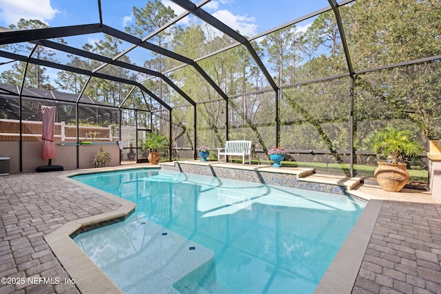 outdoor pool with a patio area and a lanai