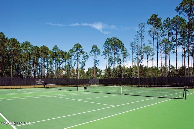 view of sport court featuring community basketball court and fence