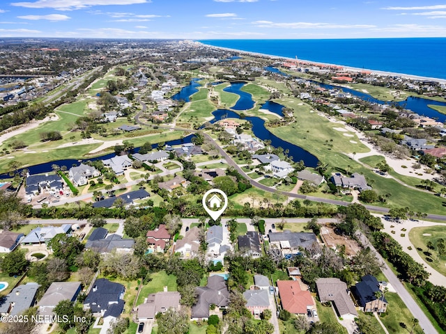 birds eye view of property with a water view and a residential view