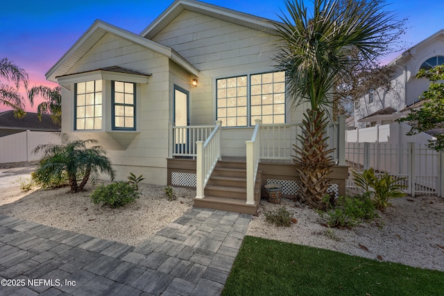 view of front of home with fence