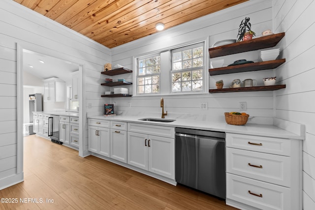 kitchen with open shelves, light countertops, wooden ceiling, stainless steel dishwasher, and a sink