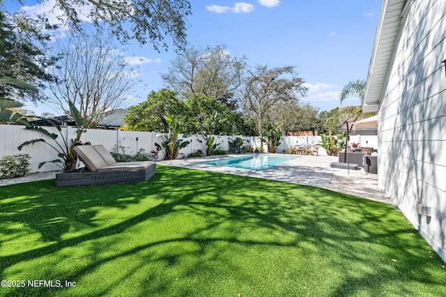 view of yard with a patio, a fenced backyard, and a fenced in pool