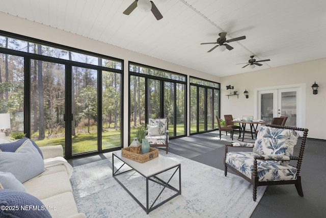 sunroom / solarium featuring french doors