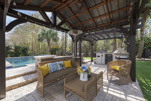 view of patio / terrace featuring an outdoor pool, an outdoor kitchen, grilling area, a gazebo, and an outdoor living space