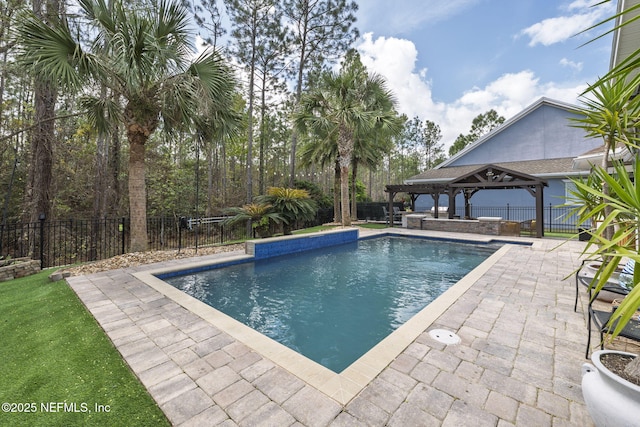 view of pool with a gazebo, a patio area, fence private yard, and a fenced in pool