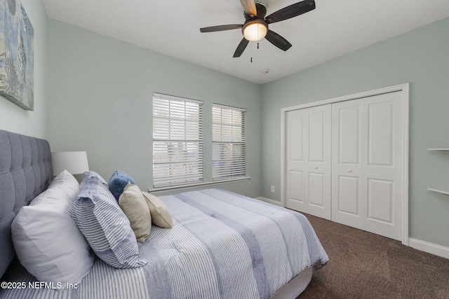 carpeted bedroom featuring a closet, a ceiling fan, and baseboards