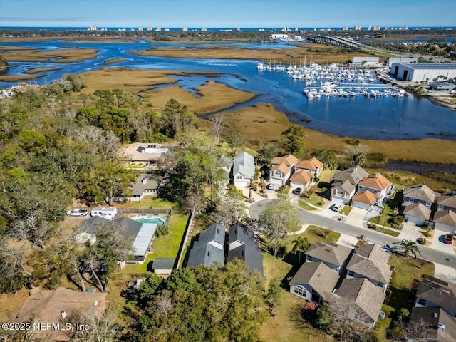 bird's eye view with a water view and a residential view