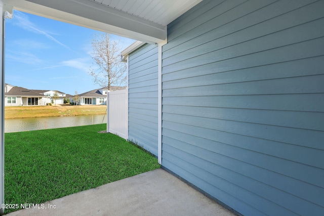 view of yard featuring a water view and a residential view