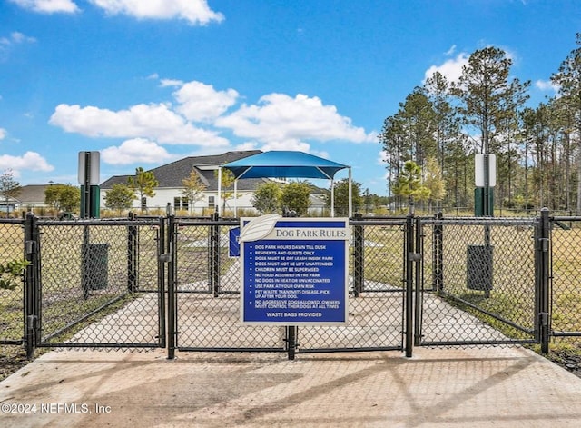 view of gate featuring fence