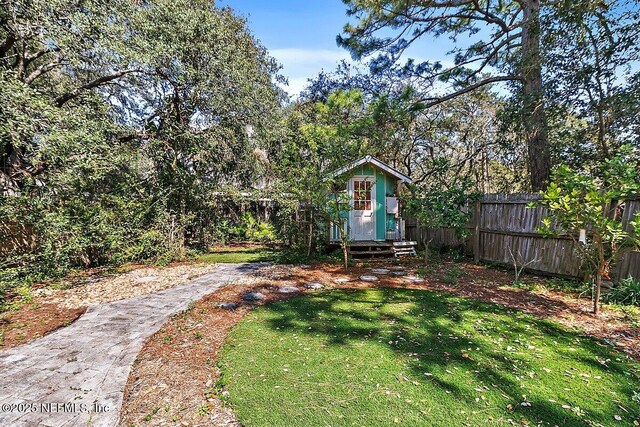 view of yard with entry steps and fence