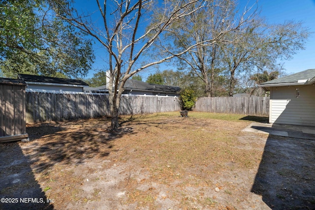 view of yard featuring a fenced backyard