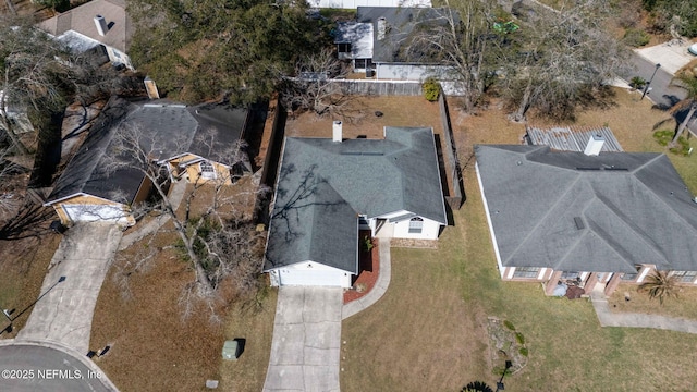 birds eye view of property with a residential view