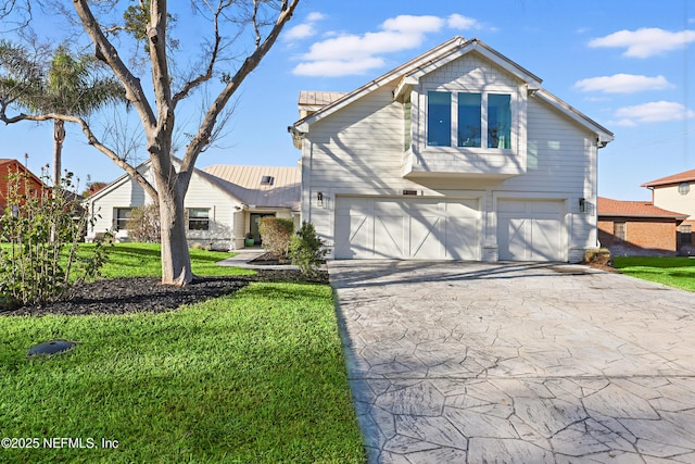 traditional-style house featuring an attached garage, driveway, and a front lawn